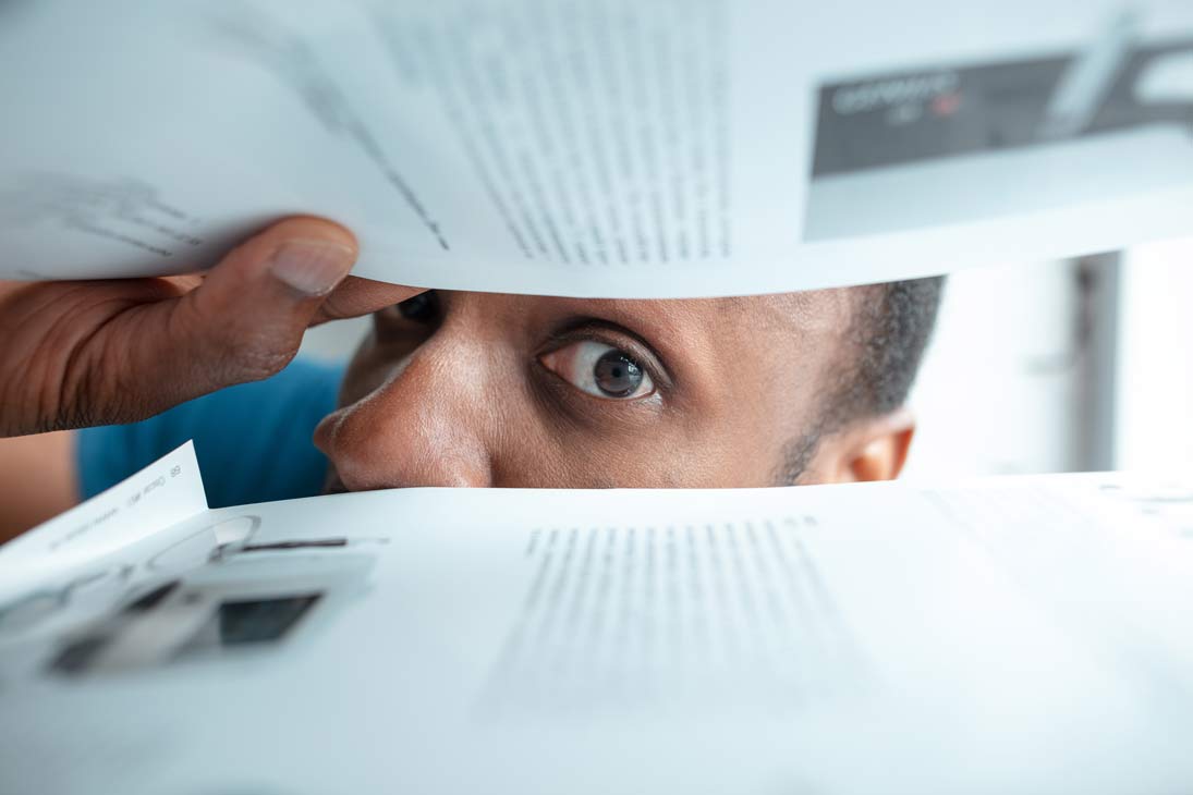 How To Find Out If Your Loved One Has A Will African-American man looking for paperwork in postage box